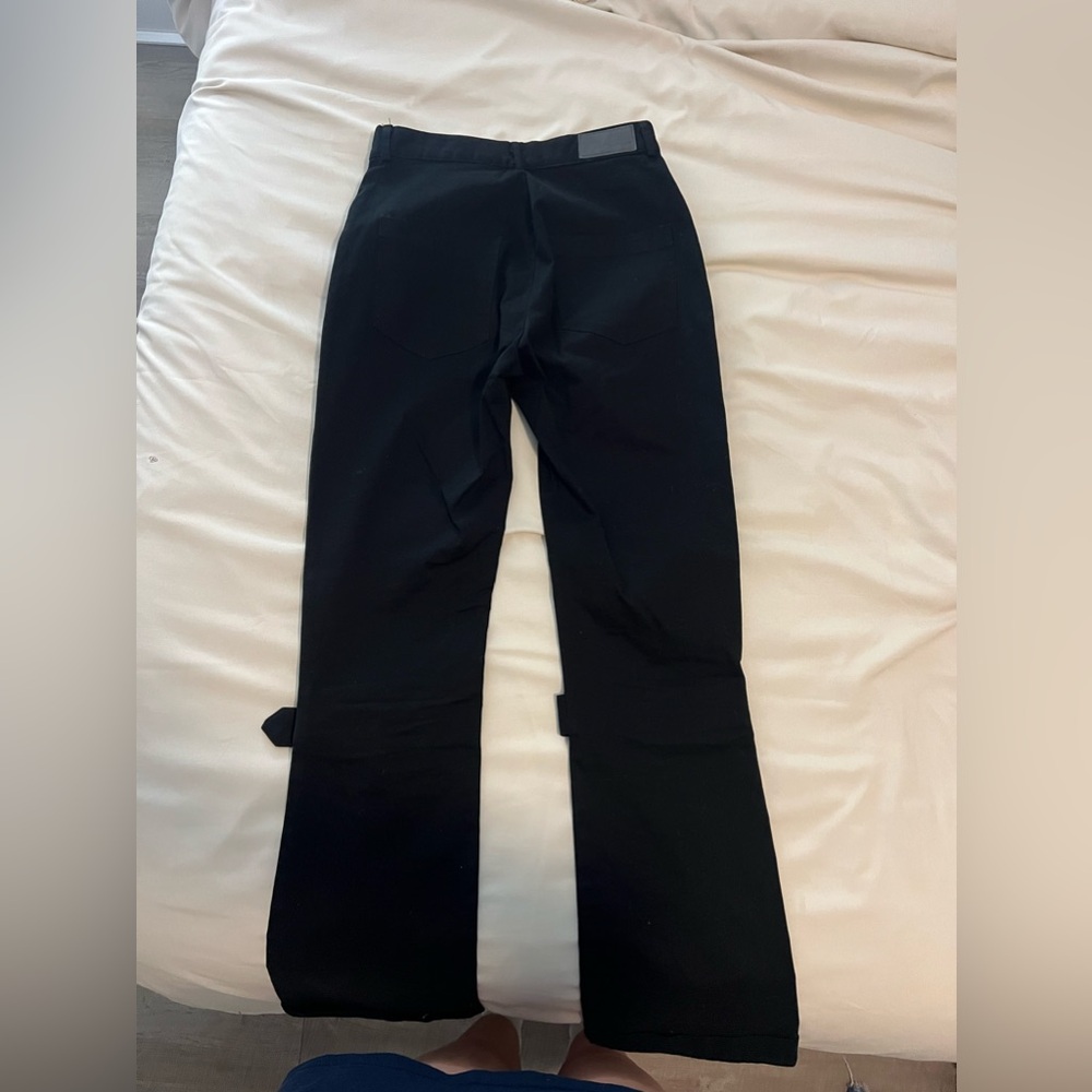 carmar black skinny pants with flare at the bottom. silver belt loops. size 4